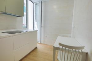 Kuchyňa alebo kuchynka v ubytovaní Piso Triana, Sevilla