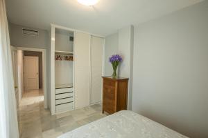 Posteľ alebo postele v izbe v ubytovaní Piso Triana, Sevilla