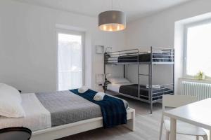 A bed or beds in a room at Numero 53 Tenna OSPITAR