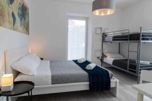 A bed or beds in a room at Numero 53 Tenna OSPITAR
