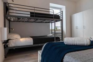 A bed or beds in a room at Numero 53 Tenna OSPITAR