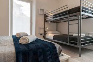 A bed or beds in a room at Numero 53 Tenna OSPITAR