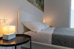 A bed or beds in a room at Numero 53 Tenna OSPITAR