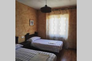 Posteľ alebo postele v izbe v ubytovaní Casa Rural La Vizana + 16 fotografií