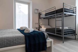 A bed or beds in a room at Numero 53 Tenna OSPITAR