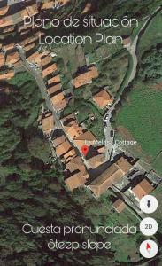 a map of a village with a red dot at La Melosa Cottage in Cudillero