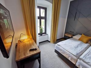 Postel nebo postele na pokoji v ubytování Hotel Gabriella