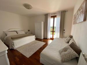 Letto o letti in una camera di Il Pagio