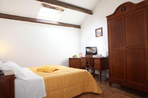 Postel nebo postele na pokoji v ubytování La Magnolia Sorrento - City Centre Hotel