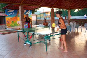a man playing a game of table tennis at Residence Trivento in Palinuro