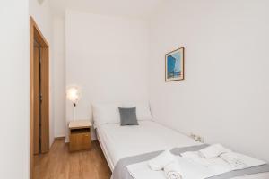 Postel nebo postele na pokoji v ubytování Villa Mihaela
