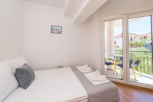 Postel nebo postele na pokoji v ubytování Villa Mihaela