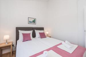 Postel nebo postele na pokoji v ubytování Villa Mihaela