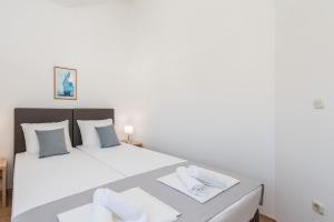 Postel nebo postele na pokoji v ubytování Villa Mihaela