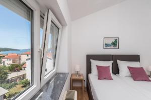 Postel nebo postele na pokoji v ubytování Villa Mihaela