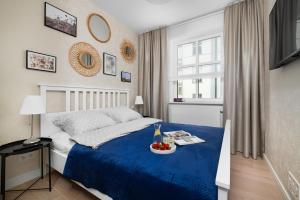 Posteľ alebo postele v izbe v ubytovaní W Sercu Warszawy Apartamenty