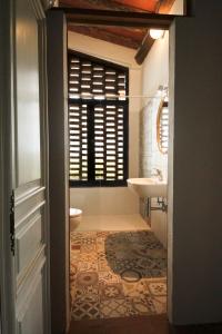 a bathroom with a toilet and a sink at Casina Di Cornia in Castellina in Chianti +22 photos