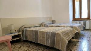 Posteľ alebo postele v izbe v ubytovaní Casa alla Cantinota Padergnone Ospitar
