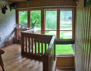 a room with a staircase and a large window at Ferienwohnung Stricker in Obertraun