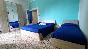 Łóżko lub łóżka w pokoju w obiekcie Casa vacanze da Cristina app B