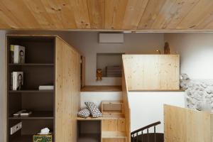 a room with a bunk bed and a book shelf at CIVICO 2 in Costa Volpino