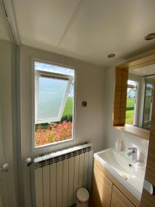 a bathroom with a sink and a window at Corte Galvana in Cento +124 photos