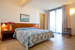 Postel nebo postele na pokoji v ubytování Hotel Idania