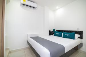 Postel nebo postele na pokoji v ubytování Hotel Esperanza AC