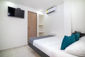 Hotel Esperanza AC tesisinde bir odada yatak veya yataklar