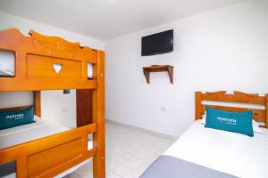 Postel nebo postele na pokoji v ubytování Hotel Esperanza AC