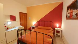 A bed or beds in a room at B&B Raggio Di Sole