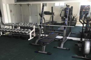 a gym with a bunch of tread machines at Ed Senses Apartamento Freedom in Tarifa