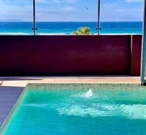 a swimming pool with a view of the ocean at Ed.Senses. Apto Infinity in Tarifa +23 photos