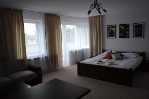 Posteľ alebo postele v izbe v ubytovaní Apartament i pokoje Szalawa