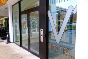a hotel sign on the door of a store at Moov'Appart Hotel Clichy in Clichy