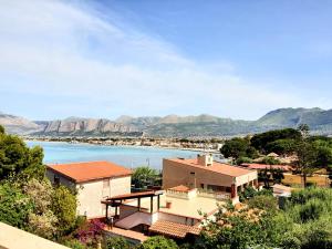 a house with a view of a body of water at Villa MiraMar Luxury Suite Palermo Airport in Carini