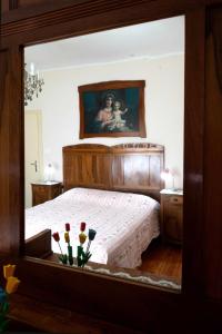 A bed or beds in a room at Appartamento Marconi 35 Pergine Valsugana