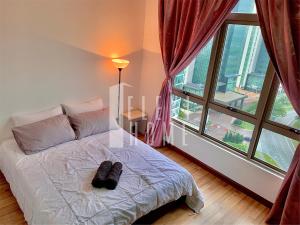 a bedroom with a bed and a large window at 9am-5pm, SAME DAY CHECK IN AND CHECK OUT, Work From Home, Shaftsbury-Cyberjaya, Comfy Home by Flexihome-MY in Cyberjaya +96 photos