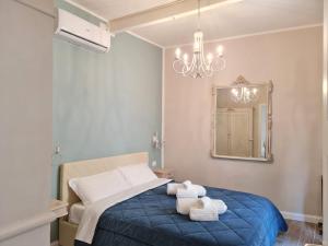 A bed or beds in a room at Maison Marina_Pavia San Michele Centro Storico