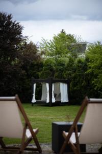 an outdoor table and chairs with a table and a table and chairs at Great Lane house in Sarajevo