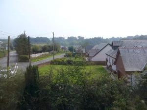 a view of a village with houses and a road at The Village Inn in Kirtlebridge