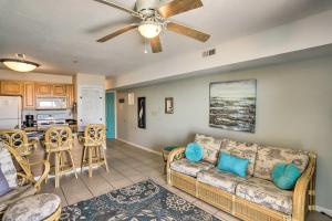 a living room with a couch and a kitchen at Waterfront Middle Bass Condo with Pool Access! in Put-in-Bay