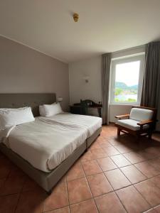 Posteľ alebo postele v izbe v ubytovaní Hotel Lenno