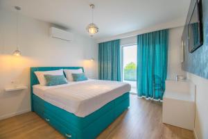 Postel nebo postele na pokoji v ubytování Villa Cipa + 26 fotografií
