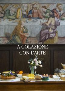 une peinture d'une table avec de la nourriture dans l'établissement Convento San Bernardino, à Montefranco