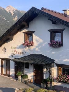 a building with flowers on the side of it at Haus Anemone in Seefeld in Tirol