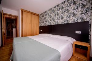 Cama o camas de una habitación en Noja Rooms