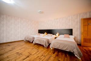 Posteľ alebo postele v izbe v ubytovaní Noja Rooms