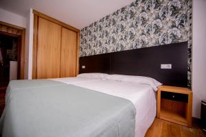 Cama o camas de una habitación en Noja Rooms