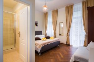 Postel nebo postele na pokoji v ubytování Riva Rooms